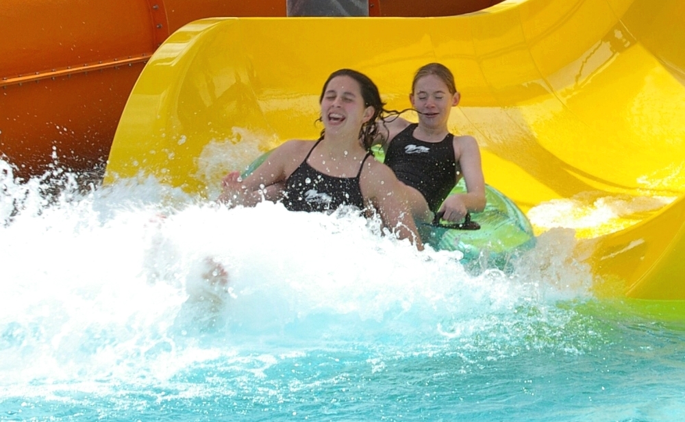 Two Happy Children Cameout from a water slide.